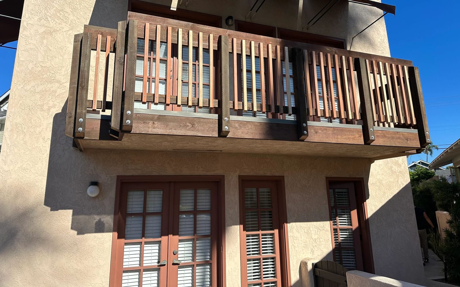 Completed AWC elevated exterior assembly with railing and adjacent access area