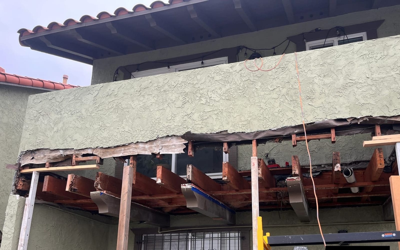 AWC exterior project photographed during an open-framing repair stage